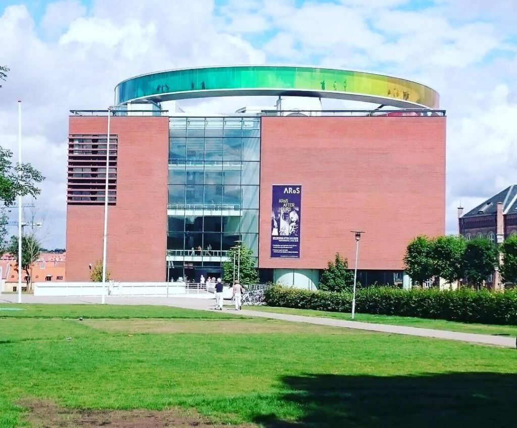 Exterior view of the ARoS Art Museum in Aarhus, Denmark, featuring the colorful rainbow panorama on the roof