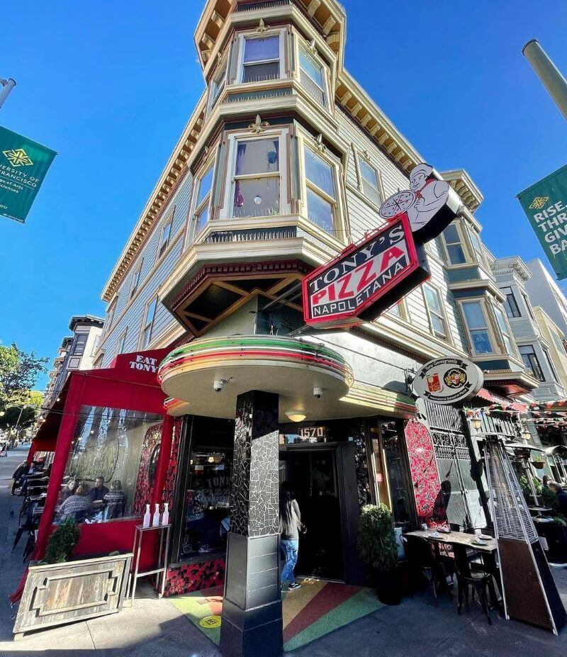 ony's Pizza Napoletana in San Francisco, featuring a colorful storefront and outdoor seating.