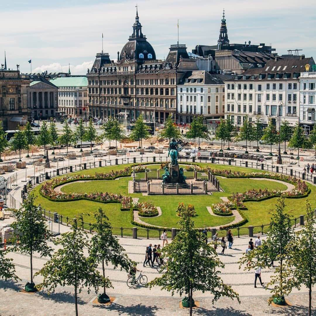 Kongens Nytorv square in Copenhagen with gardens and historic buildings