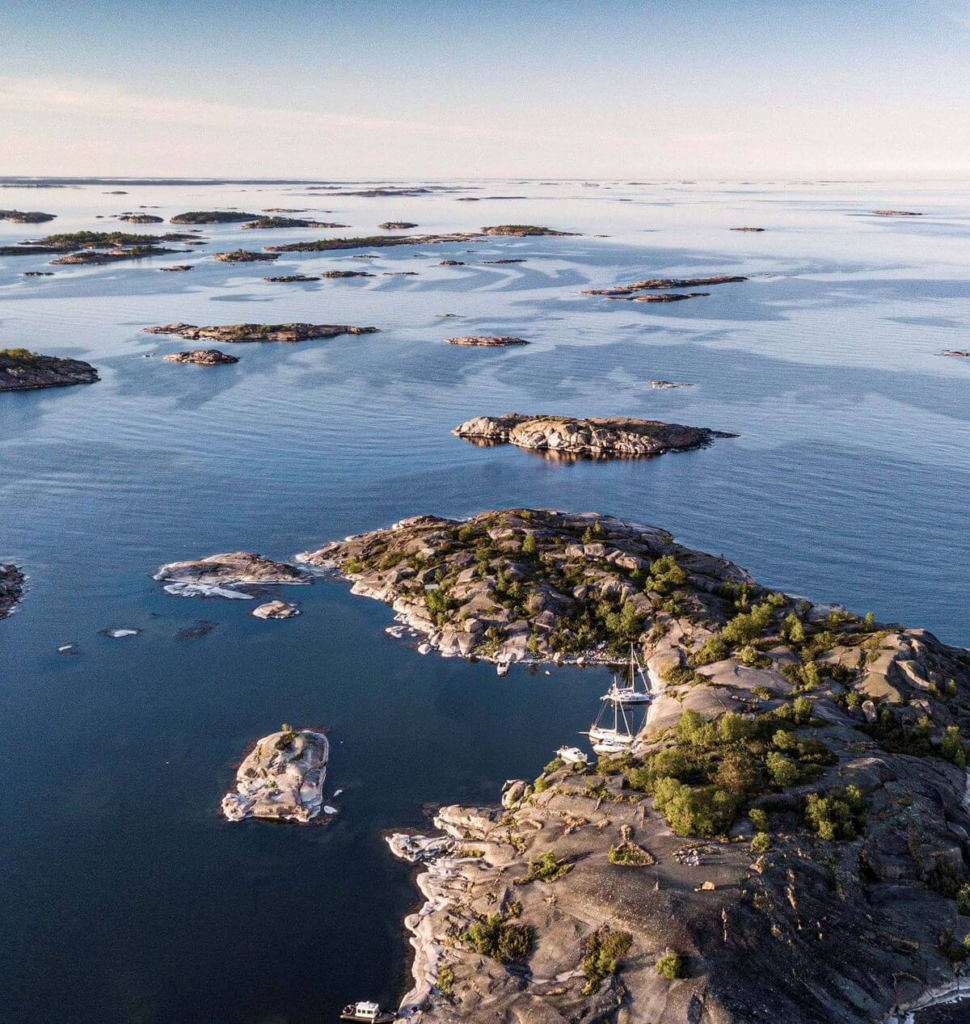 "Scenic aerial view of Stockholm Archipelago with rocky islands and calm waters.