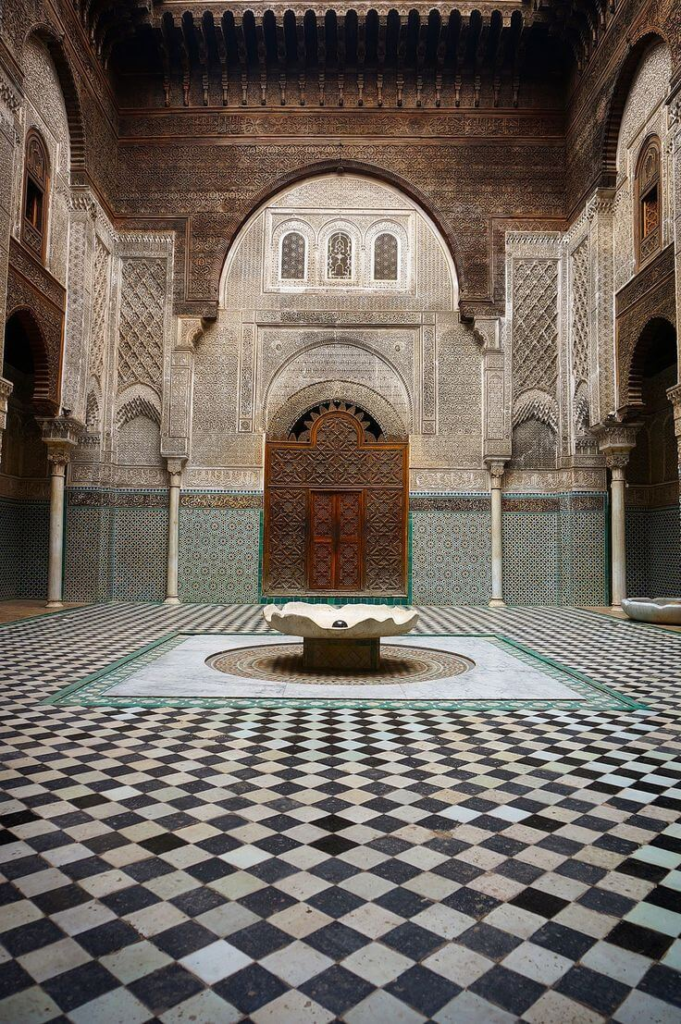 Al Attarine Madrasa courtyard in Fes with intricate Islamic tilework